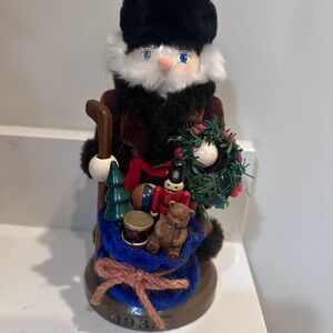 Festive Santa Nutcracker with Wreath and Gifts